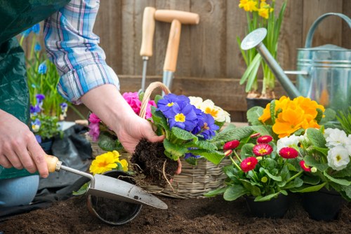 Technician assessing a garden site before starting work